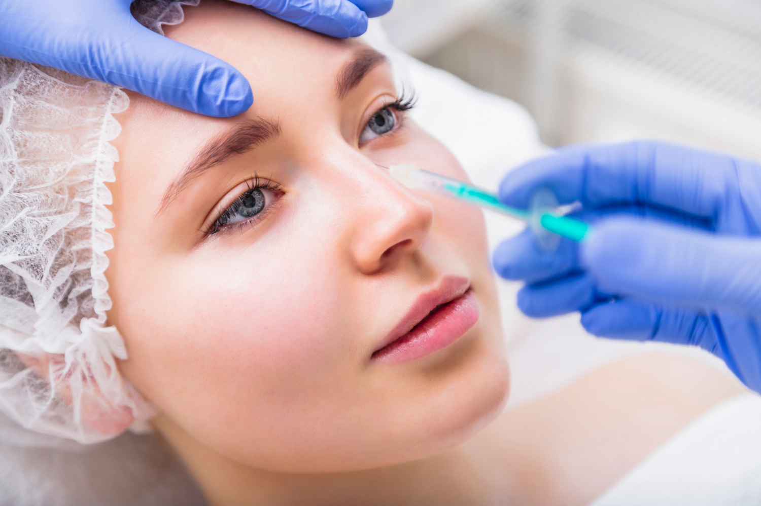 woman receiving nose slimming treatment